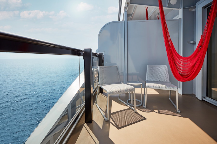 Sea Terrace balcony with signature hammock aboard the Valiant Lady