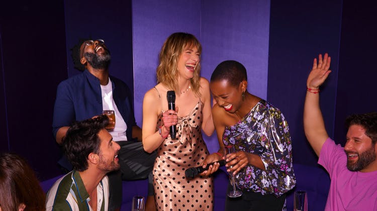 Guests laughing during an onboard show